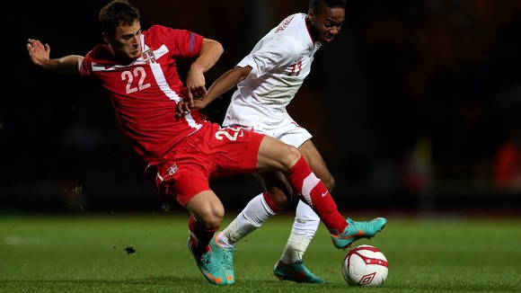 England's Raheem Sterling battles for the ball with Serbia's Filip Malbasic in the first leg last week