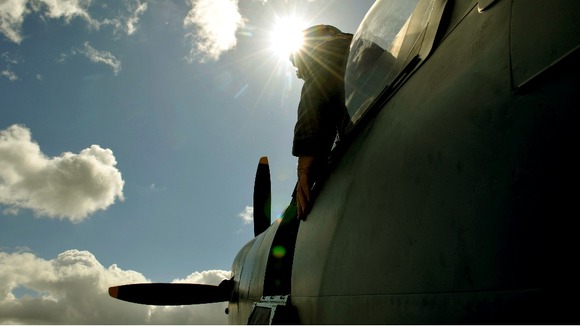 Pilot looks out the cockpit of a Spitfire