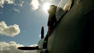 Pilot looks out the cockpit of a Spitfire