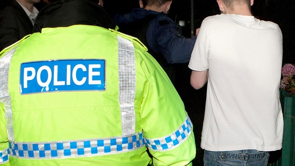 Police officers in dawn raids in North Manchester