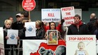A pro-life campaigner outside an abortion clinic in London. 