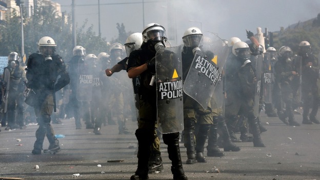 Riot police officer take position