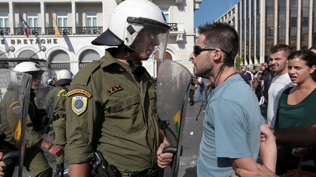 Riot police confronts protester