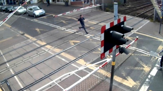 An example of misuse at Lincoln High Street – boy runs across as barriers come down