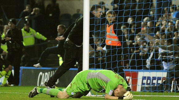 A fan shoved over Chris Kirkland and then ran behind the goal