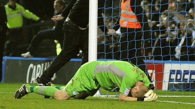 Sheffield Wednesday goalkeeper Chris Kirkland lays on the ground after been struck by a Leeds United fan