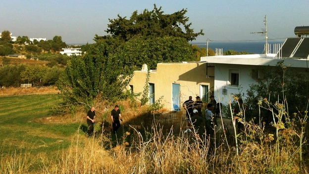 British police officers search for the remains of British boy Ben Needham in an area in the Greek island of Kos