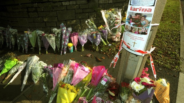 Floral tributes outside the Fire Station in Ely, Cardiff, where Karina Menzies, 32, was killed
