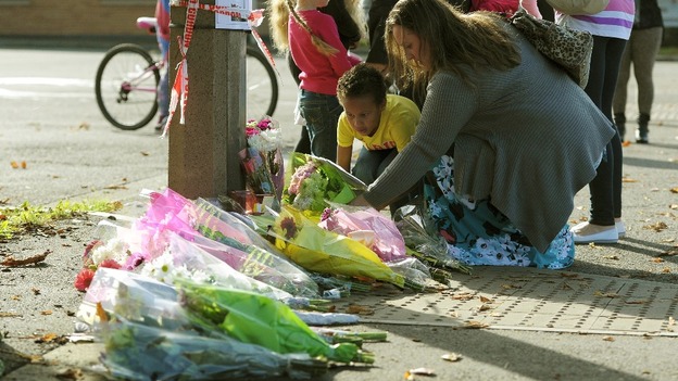 Floral tributes outside the Fire Station in Ely, Cardiff, where Karina Menzies, 32, was killed