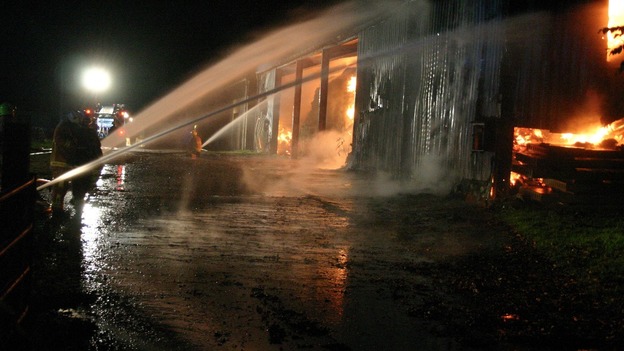 Water jets are used to put out the flames