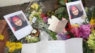 Flowers at the family home in Neasden where six people died.