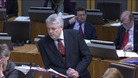 First Minister Carwyn Jones leaning on the lecturn