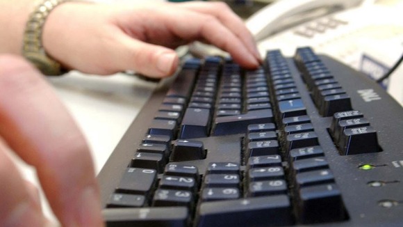 Office worker using computer.