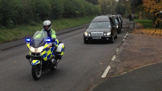 The funeral cortege was accompanied by police