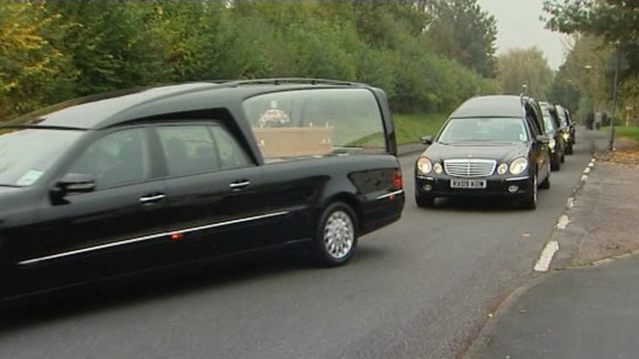 The funeral cortege arrives