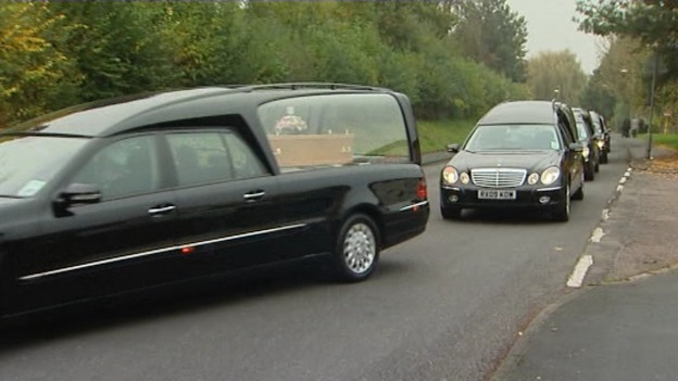 The funeral cortege arrives