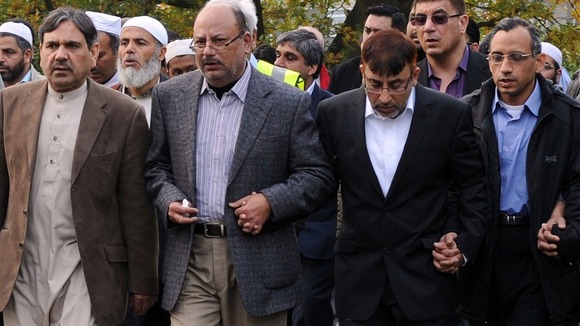 Dr Abdul Shakoor (third left) walks behind the funeral cortege