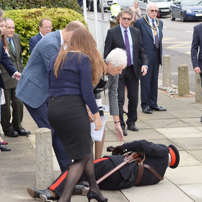 Jonathan Douglas-Hughes wearing full ceremonial uniform fell backwards onto the pavement.