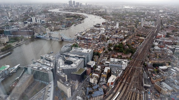 A view across London of Tower Bridge and Canary Wharf in the east from the Shard