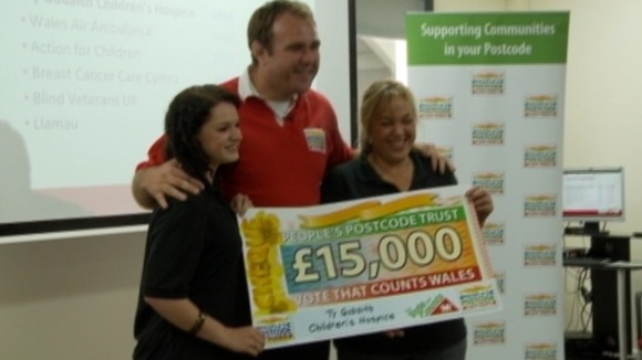 Scott Quinnell with employees from Ty Bobaith
