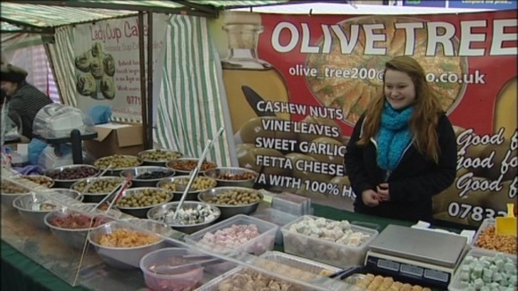 People sell international foods at the market