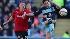 Cardiff City's Joe Mason and Burnley's Brian Stock battle for the ball during the npower Championship match at Cardiff City Stadium 