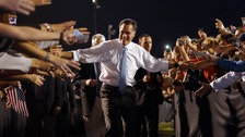 U.S. Republican Presidential nominee Mitt Romney leaves a campaign rally through a corridor of supporters in Land O'Lakes on Saturday.