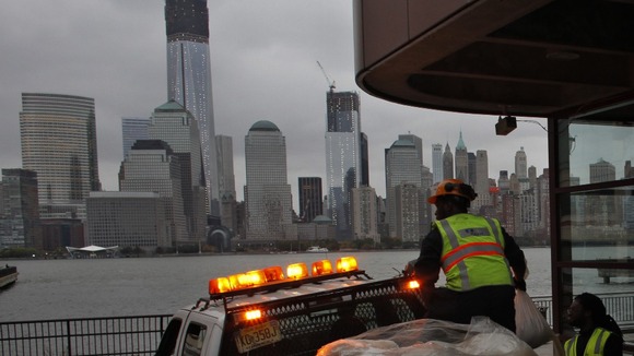 Workers place sandbags at Exchange Place in New Jersey
