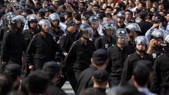 Riot police marched in Ningbo.