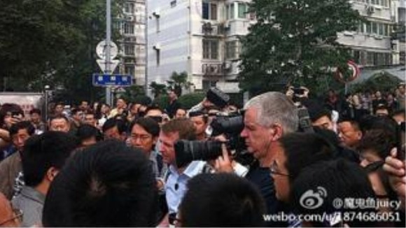 Photos of Angus Walker reporting.