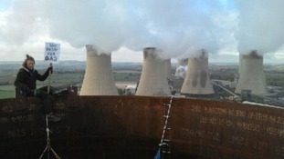 Protesters are tweeting pictures of themselves at the top of the chimney stacks