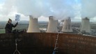 Protesters are tweeting pictures of themselves at the top of the chimney stacks