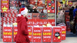 Christmas Shopper and shop filled with Christmas wrapping paper
