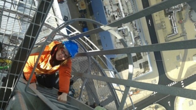 One of the protesters climbing the chimney