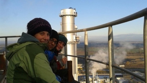 Protesters are tweeting pictures of themselves at the top of the chimney stacks