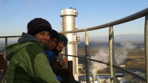 Protesters are tweeting pictures of themselves at the top of the chimney stacks