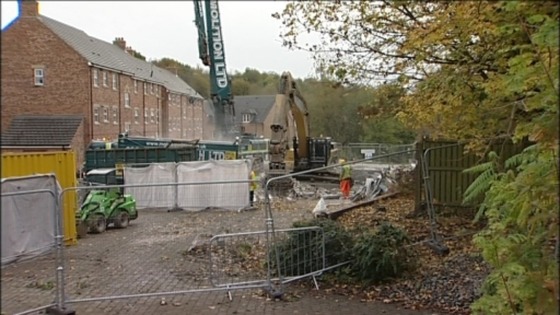 The second week into its demolition, the remnants of Spencer Court are cleared away