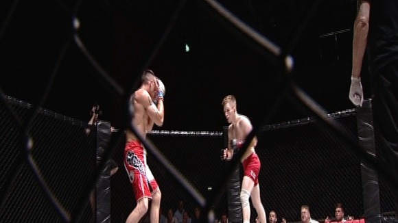 Two fighters in the caged octagon