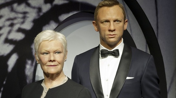 Wax works of Dame Judi Dench and Daniel Craig