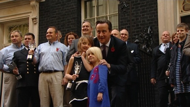 Ramona Gibbs with her sister Trixie who she pushed out of the way of a speeding car, with the prime Minister