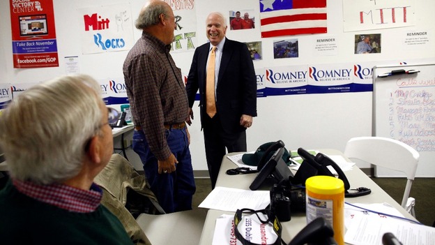Senator John McCain meets volunteers at the campaign headquarters for Mitt Romney in Columbus, Ohio
