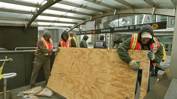 Workers attempt to repair the New York subway following Sandy.
