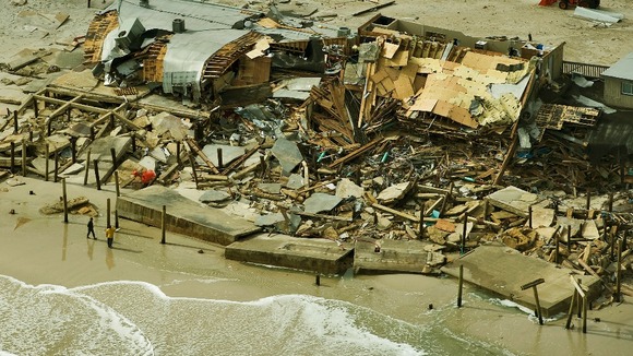 Residents in Seaside Heights, New Jersey, look over destroyed homes on the shore