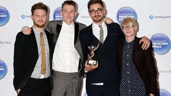Indie quartet Alt-J celebrate their win.