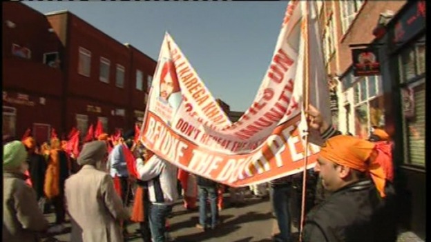 Protesters with banner in Birmingham this lunchtime