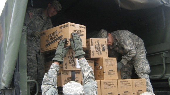 New York Army National Guard Soldiers load meals for emergency food distribution in Brooklyn, New York.