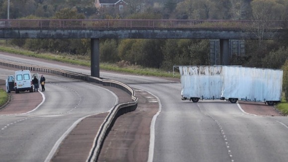Police attend the scene of David Black's murder