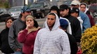 People wait in line to buy gas at a station at Union City, New Jersey.