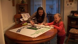 Ria Stonehouse, who has had the surgery, preparing banners with her mum Michelle.