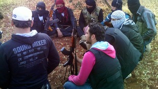 Members of the Free Syrian Army gather as they meet in the outskirts of Taftanaz village